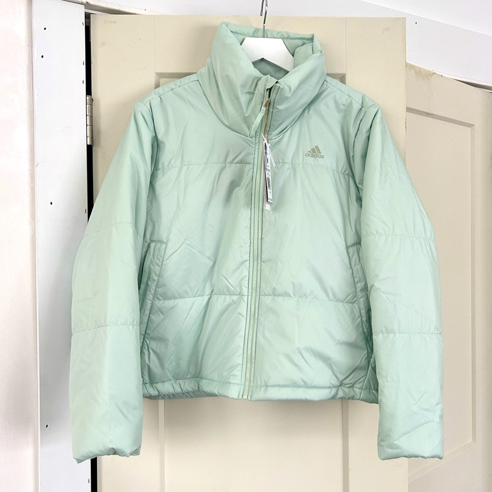 Adidas women’s puffer jacket in Linen green. Size M NWT